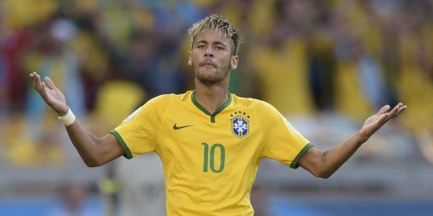 Brazil's forward Neymar celebrates after scoring during the penalty shoot out after extra-time in the Round of 16 football match between Brazil and Chile at The Mineirao Stadium in Belo Horizonte during the 2014 FIFA World Cup on June 28, 2014. AFP PHOTO / JUAN MABROMATA (Photo credit should read JUAN MABROMATA/AFP/Getty Images)