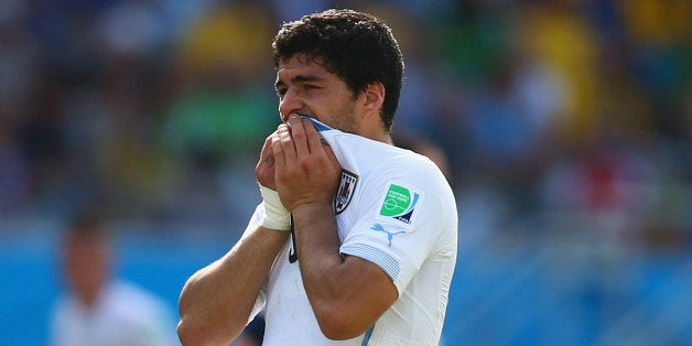 NATAL, BRAZIL - JUNE 24: Luis Suarez of Uruguay reacts during the 2014 FIFA World Cup Brazil Group D match between Italy and Uruguay at Estadio das Dunas on June 24, 2014 in Natal, Brazil. (Photo by Clive Rose/Getty Images)