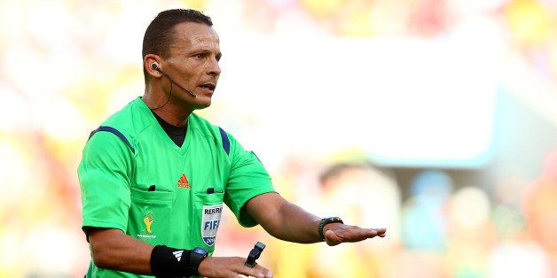 PORTO ALEGRE, BRAZIL - JUNE 18: Referee Djamel Haimoudi gestures during the 2014 FIFA World Cup Brazil Group B match between Australia and Netherlands at Estadio Beira-Rio on June 18, 2014 in Porto Alegre, Brazil. (Photo by Cameron Spencer/Getty Images)