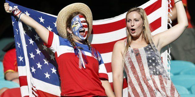 US supporters cheer for their team ahead of the Round of 16 football match between Belgium and USA at The Fonte Nova Arena in Salvador on July 1, 2014, during the 2014 FIFA World Cup. AFP PHOTO / ADRIAN DENNIS (Photo credit should read ADRIAN DENNIS/AFP/Getty Images)
