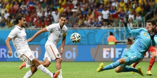 US forward Chris Wondolowski (L) shoots past Belgium's goalkeeper Thibaut Courtois during a Round of 16 football match between Belgium and USA at Fonte Nova Arena in Salvador during the 2014 FIFA World Cup on July 1, 2014. AFP PHOTO/ FRANCISCO LEONG (Photo credit should read FRANCISCO LEONG/AFP/Getty Images)