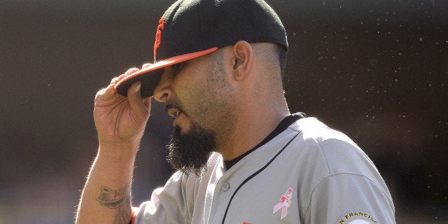 LOS ANGELES, CA - MAY 11: Sergio Romo #54 of the San Francisco Giants reacts as he leaves the mound after allowing a two run