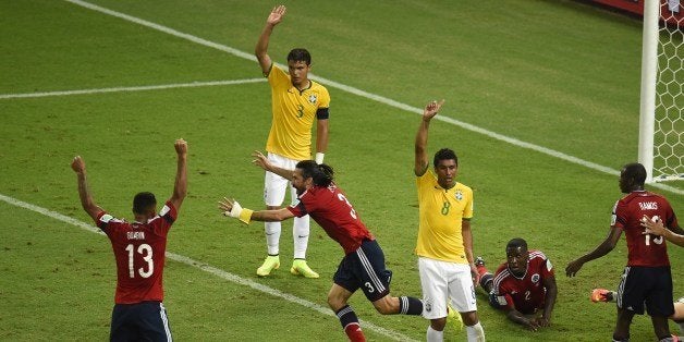 Colombia's defender and captain Mario Alberto Yepes (C) celebrates after scoring a goal that was disallowed during the quarte