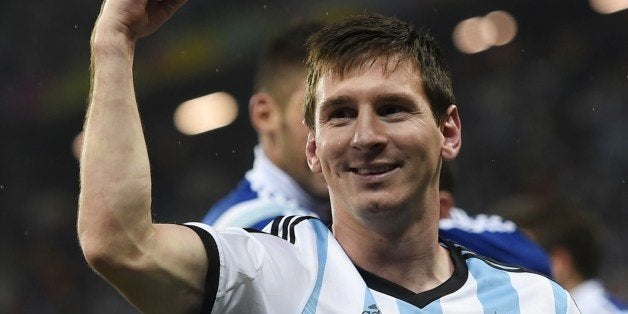 Argentina's forward and captain Lionel Messi celebrates after winning their FIFA World Cup semi-final match against the Netherlands in a penalty shoot-out following extra time at The Corinthians Arena in Sao Paulo on July 9, 2014. AFP PHOTO / FABRICE COFFRINI (Photo credit should read FABRICE COFFRINI/AFP/Getty Images)