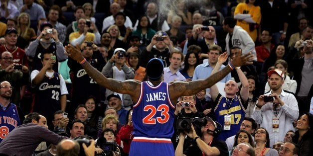 OAKLAND, CA - JANUARY 11: LeBron James #23 of the Cleveland Cavaliers throws chalk up in the air before their game against t