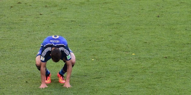 Argentina's forward Gonzalo Higuain reacts after a shot on goal during the final football match between Germany and Argentina