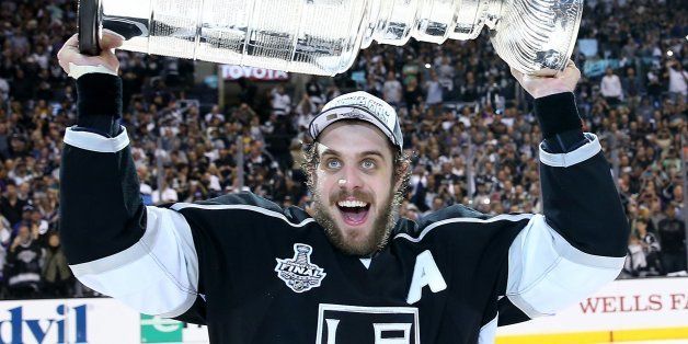LOS ANGELES, CA - JUNE 13: Anze Kopitar #11 of the Los Angeles Kings celebrates with the Stanley Cup after the Kings 3-2 double overtime victory against the New York Rangers in Game Five of the 2014 Stanley Cup Final at Staples Center on June 13, 2014 in Los Angeles, California. (Photo by Bruce Bennett/Getty Images) 