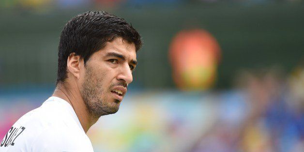 Uruguay's forward Luis Suarez attends the Group D football match between Italy and Uruguay at the Dunas Arena in Natal during the 2014 FIFA World Cup on June 24, 2014. AFP PHOTO / EMMANUEL DUNAND (Photo credit should read EMMANUEL DUNAND/AFP/Getty Images)