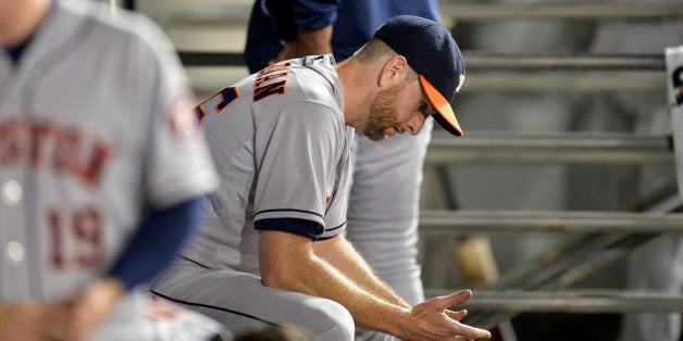 CHICAGO, IL - JULY 18: Starting pitcher Scott Feldman #46 of the Houston Astros sits in the dugout after the seventh inning against the Chicago White Sox at U.S. Cellular Field on July 18, 2014 in Chicago, Illinois. (Photo by Brian Kersey/Getty Images)