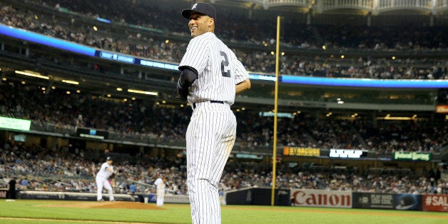 NEW YORK, NY - JULY 21: Derek Jeter #2 of the New York Yankees heads onto the field during the game against the Texas Rangers on July 21, 2014 at Yankee Stadium in the Bronx borough of New York City.The Texas Rangers defeated the New York Yankees 4-2. (Photo by Elsa/Getty Images) 