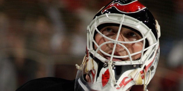 NEWARK, NJ - APRIL 11: Martin Brodeur #30 of the New Jersey Devils takes a break during the third period against the New York Islanders at the Prudential Center on April 11, 2014 in Newark, New Jersey. The Islanders defeated the Devils 3-2 in the shootout. (Photo by Bruce Bennett/Getty Images)