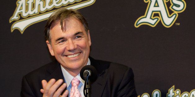 OAKLAND, CA - DECEMBER 18: Oakland Athletics vice president and general manager Billy Beane and Hiroyuki Nakajima of Japan joke with each other at a press conference where Beane introduced Nakajima to the Oakland Athletics at the O.co Coliseum on December 18, 2012 in Oakland, California. Nakajima signed a two-year contract through 2014 with a club option for 2015. (Photo by Ezra Shaw/Getty Images)