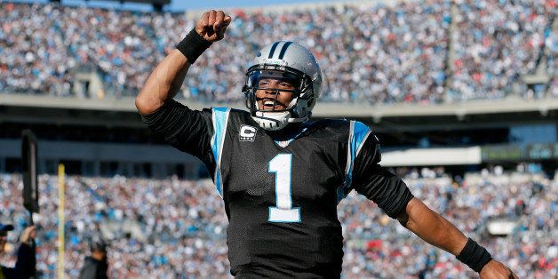 CHARLOTTE, NC - JANUARY 12: Cam Newton #1 of the Carolina Panthers celebrates after a touchdown pass to Steve Smith #89 in the second quarter against the San Francisco 49ers during the NFC Divisional Playoff Game at Bank of America Stadium on January 12, 2014 in Charlotte, North Carolina. (Photo by Kevin C. Cox/Getty Images)