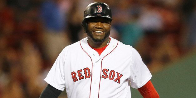 BOSTON, MA - JULY 1: David Ortiz #34 of the Boston Red Sox smiles as he leaves the field in the seventh inning against the Chicago Cubs at Fenway Park on July 1, 2014 in Boston, Massachusetts. (Photo by Jim Rogash/Getty Images)