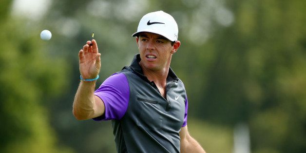 LOUISVILLE, KY - AUGUST 10: Rory McIlroy of Northern Ireland catches a golf ball on the practice range during the final round of the 96th PGA Championship at Valhalla Golf Club on August 10, 2014 in Louisville, Kentucky. (Photo by Andy Lyons/Getty Images)
