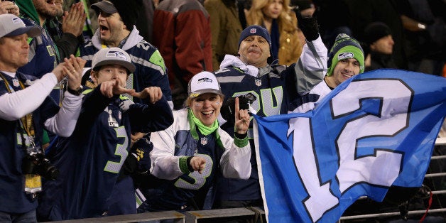 EAST RUTHERFORD, NJ - FEBRUARY 02: Seattle fans hold a '12th Man' flag during Super Bowl XLVIII at MetLife Stadium on February 2, 2014 in East Rutherford, New Jersey. (Photo by Christian Petersen/Getty Images)