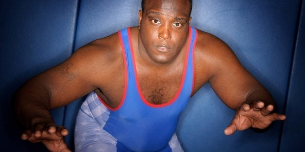 COLORADO SPRINGS, CO - APRIL 30: Dremiel Byers (Blue), USA Olympic Greco-Roman Wrestler in the 120 kg weight class, works ou