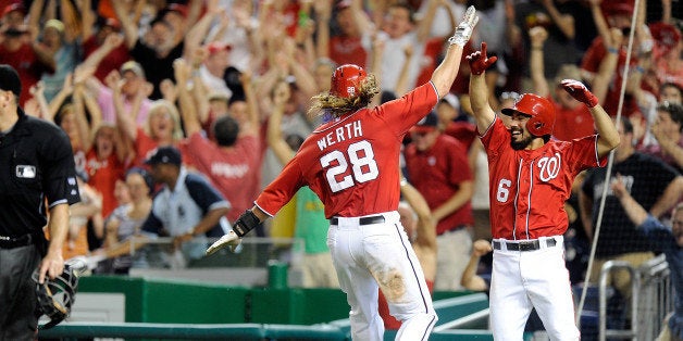 WASHINGTON, DC - AUGUST 17: Jayson Werth #28 of the Washington Nationals celebrates with Anthony Rendon #6 after scoring the