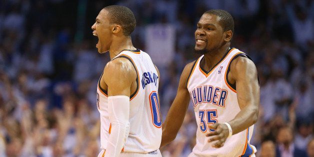 OKLAHOMA CITY, OK - MAY 13: (L-R) Russell Westbrook #0 and Kevin Durant celebrate a 105-104 win against the Los Angeles Clippers in Game Five of the Western Conference Semifinals during the 2014 NBA Playoffs at Chesapeake Energy Arena on May 13, 2014 in Oklahoma City, Oklahoma. NOTE TO USER: User expressly acknowledges and agrees that, by downloading and or using this photograph, User is consenting to the terms and conditions of the Getty Images License Agreement. (Photo by Ronald Martinez/Getty Images)