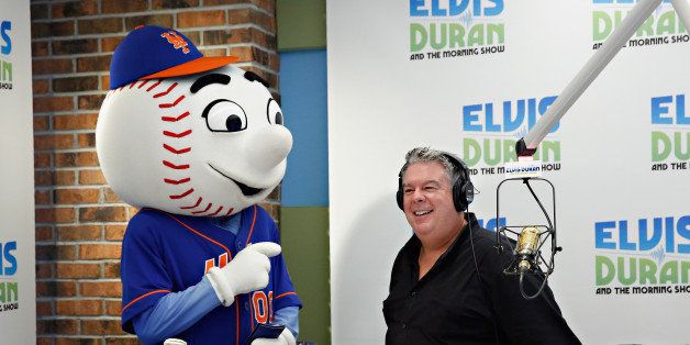NEW YORK, NY - AUGUST 05: (EXCLUSIVE COVERAGE/SPECIAL RATES APPLY) The official mascot of Major League Baseball's New York Mets', Mr. Met brings Elvis Duran a birthday gift as 'The Elvis Duran Z100 Morning Show' celebrate Elvis Duran's 50th Birthday at Z100 Studio on August 5, 2014 in New York City. (Photo by Cindy Ord/Getty Images)
