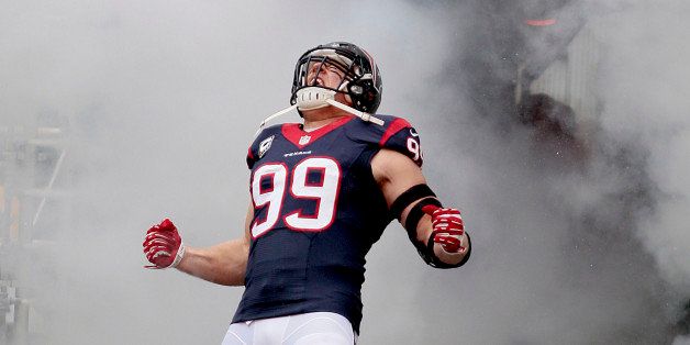 HOUSTON, TX- DECEMBER 01: J.J. Watt #99 of the Houston Texans is introduced before playing against the New England Patriots on December 1, 2013 at Reliant Stadium in Houston, Texas. (Photo by Thomas B. Shea/Getty Images)