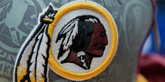 The Washington Redskins football team logo is displayed on a hat for sale at a store in San Francisco, California, U.S., on Wednesday, June 18, 2014. The Washington Redskins lost a trademark decision after a federal agency ruled the team's name disparaged Native Americans, threatening millions of dollars in sales of everything from football jerseys to beer coolers. Photographer: David Paul Morris/Bloomberg via Getty Images