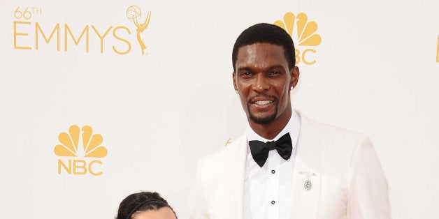 LOS ANGELES, CA - AUGUST 25: NBA player Chris Bosh (R) and wife Adrienne Bosh attend the 66th annual Primetime Emmy Awards at Nokia Theatre L.A. Live on August 25, 2014 in Los Angeles, California. (Photo by Jason LaVeris/FilmMagic)