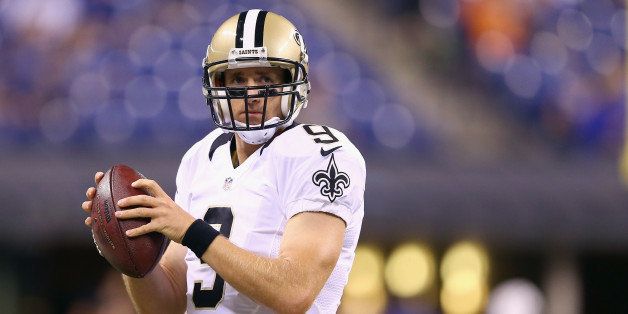 INDIANAPOLIS, IN - AUGUST 23: Drew Brees #9 of the New Orleans Saints prepares for the game against the Indianapolis Colts before the exhibition game at Lucas Oil Stadium on August 23, 2014 in Indianapolis, Indiana. (Photo by Andy Lyons/Getty Images)
