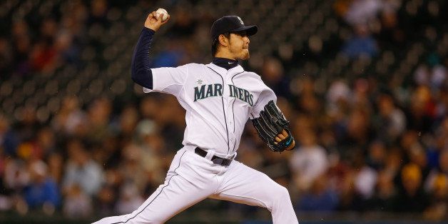 SEATTLE, WA - MAY 08: Starting pitcher Hisashi Iwakuma #18 of the Seattle Mariners pitches in the second inning against the Kansas City Royals at Safeco Field on May 8, 2014 in Seattle, Washington. (Photo by Otto Greule Jr/Getty Images)