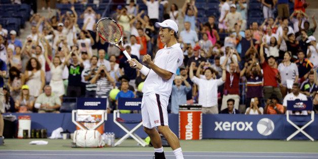 Kei Nishikori, of Japan, reacts after defeating Milos Raonic, of Canada, during the fourth round of the 2014 U.S. Open tennis tournament Tuesday, Sept. 2, 2014, in New York. (AP Photo/Darron Cummings)