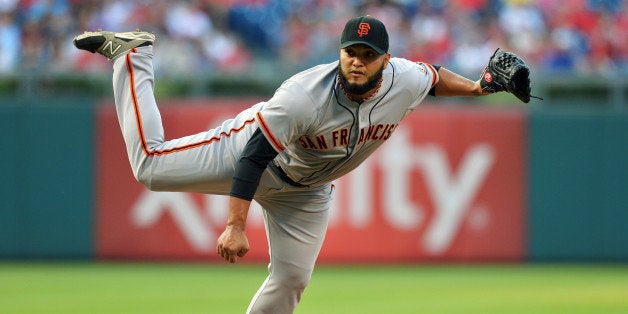 PHILADELPHIA, PA - JULY 22: Starting pitcher Yusmeiro Petit #52 of the San Francisco Giants follows through on a pitch in the