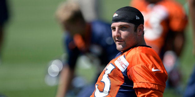 ENGLEWOOD, CO - JULY 25: Denver Broncos wide receiver Wes Welker (83) stretches during day two of the Denver Broncos 2014 tra
