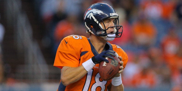 DENVER, CO - AUGUST 23: Quarterback Peyton Manning #18 of the Denver Broncos in action against the Houston Texans during a p