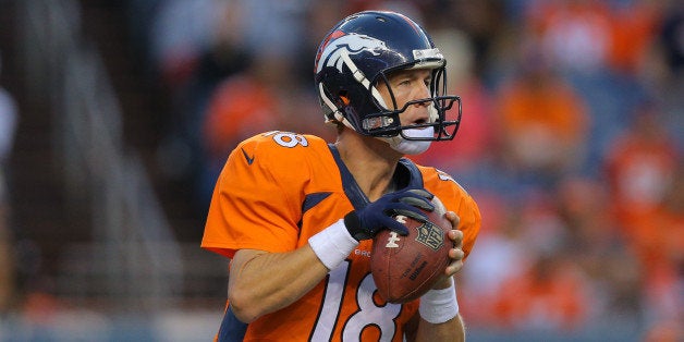 DENVER, CO - AUGUST 23: Quarterback Peyton Manning #18 of the Denver Broncos in action against the Houston Texans during a preseason game at Sports Authority Field at Mile High on August 23, 2014 in Denver, Colorado. (Photo by Justin Edmonds/Getty Images)