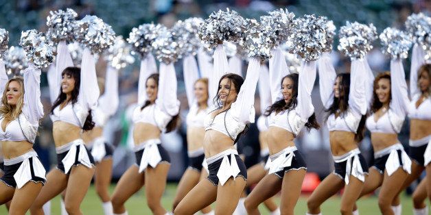 OAKLAND, CA - AUGUST 15: The Raiderettes, the Oakland Raiders cheerleaders, perform during the Oakland Raiders preseason game against the Detroit Lions at O.co Coliseum on August 15, 2014 in Oakland, California. (Photo by Ezra Shaw/Getty Images)