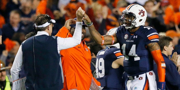 AUBURN, AL - NOVEMBER 30: Nick Marshall #14 celebrates with head coach Gus Malzahn of the Auburn Tigers in the fourth quarter against the Alabama Crimson Tide at Jordan-Hare Stadium on November 30, 2013 in Auburn, Alabama. (Photo by Kevin C. Cox/Getty Images)