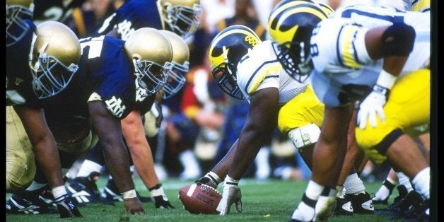 10 Sep 1994: Center Rod Payne of the Michigan Wolverines prepares to snap the ball during a game against the Notre Dame Fighting Irish at Notre Dame Stadium in South Bend, Indiana. Michigan won the game 26-24. Mandatory Credit: Jonathan Daniel /Allspor