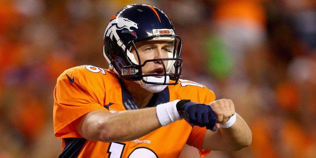 DENVER, CO - SEPTEMBER 07: Quarterback Peyton Manning #18 of the Denver Broncos calls out a play against the Indianapolis C