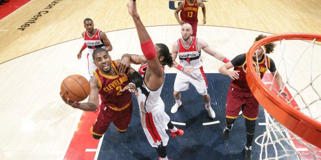 WASHINGTON, DC - FEBRUARY 7: Kyrie Irving #2 of the Cleveland Cavaliers shoots against Nene #42 of the Washington Wizards during the game at the Verizon Center on February 7, 2014 in Washington, DC. NOTE TO USER: User expressly acknowledges and agrees that, by downloading and or using this photograph, User is consenting to the terms and conditions of the Getty Images License Agreement. Mandatory Copyright Notice: Copyright 2014 NBAE (Photo by Ned Dishman/NBAE via Getty Images)