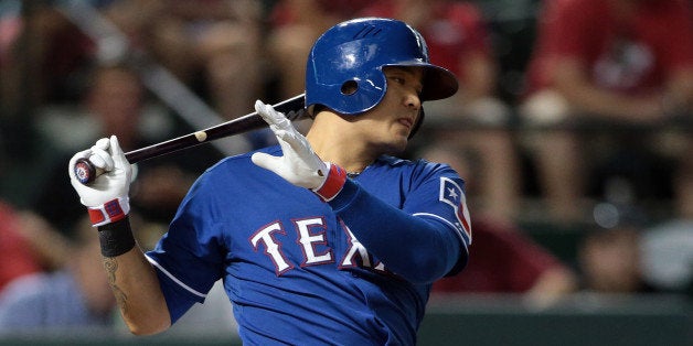 ARLINGTON, TX - AUGUST 12: Shin-Soo Choo #17 of the Texas Rangers hits in the ninth inning against the Tampa Bay Rays at Globe Life Park in Arlington on August 12, 2014 in Arlington, Texas. (Photo by Rick Yeatts/Getty Images)