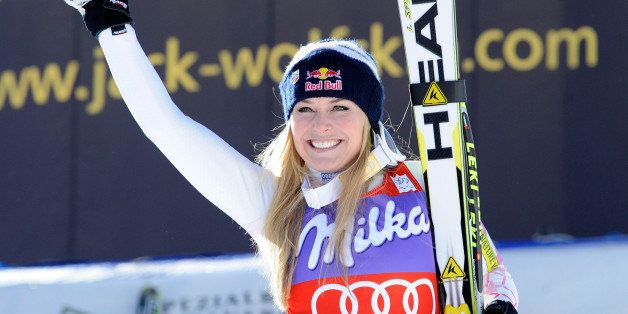 FILE - In this Saturday, Jan. 19, 2013 file photo, Lindsey Vonn, of the United States, celebrates at the finish area after winning an Alpine Ski World Cup women's downhill, in Cortina D'Ampezzo, Italy. Lindsey Vonn has won her sixth straight World Cup downhill title after thick fog forced the scheduled final race to be cancelled on Wednesday March 13, 2013. Five weeks after her season was ended by a serious knee injury, Vonn has retained her title by a single point from Tina Maze of Slovenia. (AP Photo/Giovanni Auletta, File)
