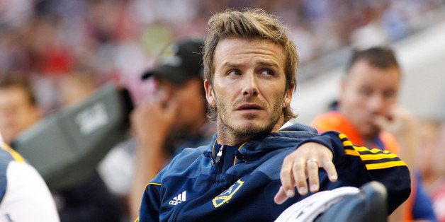 HARRISON, NJ - AUGUST 14: David Beckham #23 of the Los Angeles Galaxy looks on from the bench during their match against the New York Red Bulls on August 14, 2010 at Red Bull Arena in Harrison, New Jersey. Galaxy defeat the Red Bulls 1-0. (Photo by Mike Stobe/Getty Images for New York Red Bulls)