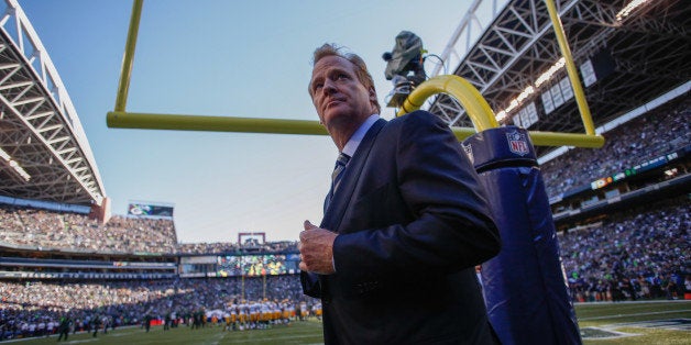SEATTLE, WA - SEPTEMBER 04: NFL commissioner Roger Goodell walks the sidelines prior to the game between the Seattle Seahawk