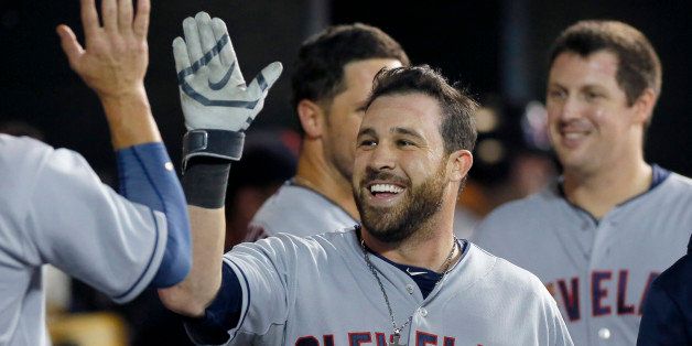DETROIT, MI - JULY 18: Jason Kipnis #22 of the Cleveland Indians smiles in the dugout after hitting a solo home run against the Detroit Tigers, his second of the game, during the eighth inning at Comerica Park on July 18, 2014 in Detroit, Michigan. (Photo by Duane Burleson/Getty Images)