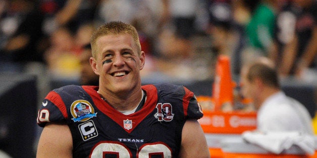 FILE - In this Dec. 16, 2012 file photo, Houston Texans' J.J. Watt stands on the sidelines in the fourth quarter of an NFL fo