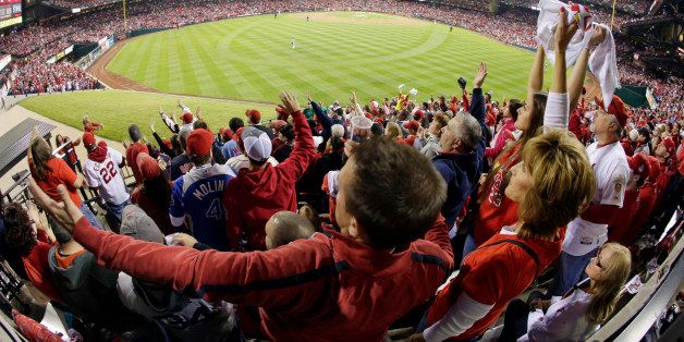 Fans cheer during the second inning of Game 5 of baseball's World Series between the Boston Red Sox and the St. Louis Cardinals Monday, Oct. 28, 2013, in St. Louis. (AP Photo/Charlie Riedel)