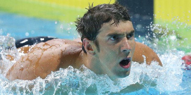 GOLD COAST, AUSTRALIA - AUGUST 22: Michael Phelps of the USA looks on after swimming the Men's 100m Freestyle Final during day two of the 2014 Pan Pacific Championships at Gold Coast Aquatics on August 22, 2014 in Gold Coast, Australia. (Photo by Chris Hyde/Getty Images)