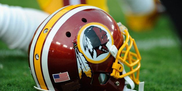 LANDOVER, MD - AUGUST 18: A Washington Redskins helmet sits on the grass during a preseason football game between the Redskins and Cleveland Browns at FedExField on August 18, 2014 in Landover, Maryland. (Photo by TJ Root/Getty Images)