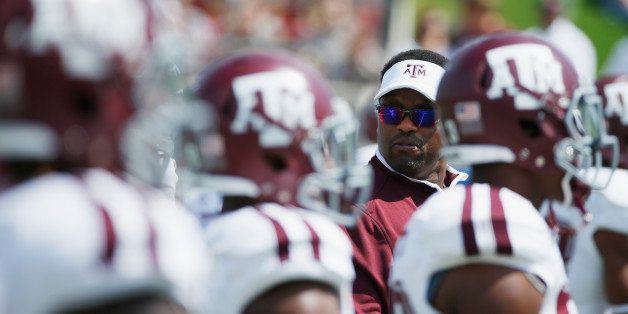 DALLAS, TX - SEPTEMBER 20: Head coach Kevin Sumlin of the Texas A&M Aggies works with his team on the field prior to the start of their game against the Southern Methodist Mustangs at the Gerald J. Ford Stadium on September 20, 2014 in Dallas, Texas. (Photo by Scott Halleran/Getty Images)