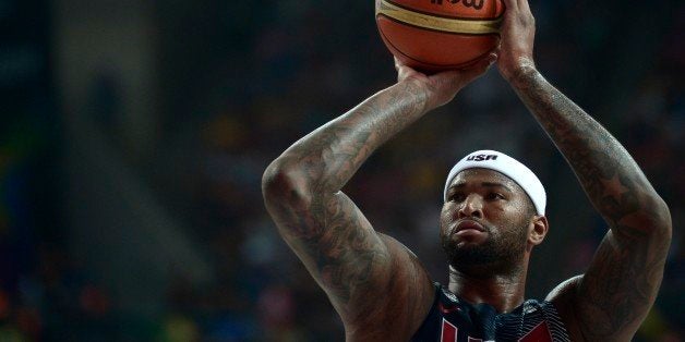 United States's DeMarcus Cousins shoots to the basket during the Basketball World Cup semifinal match against Lithuania at the Palau Sant Jordi in Barcelona, Spain, Thursday, Sept. 11, 2014. The 2014 Basketball World Cup competition will take place in various cities in Spain from Aug. 30 through Sept. 14. (AP Photo/Manu Fernandez)